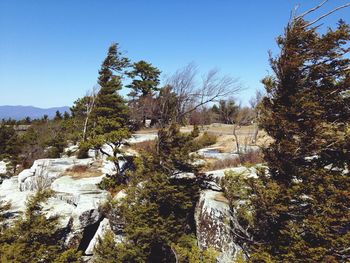 Scenic view of mountains against clear blue sky