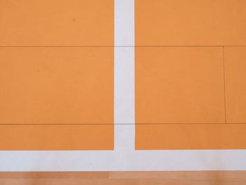 White line in hall playground. wooden floor of sports hall with marking lines and lacquered surface