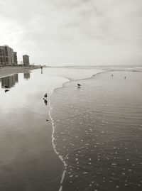 View of buildings against cloudy sky
