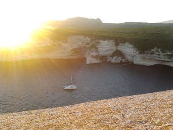 Sun shining over sea