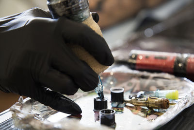 Close-up of man working at workshop
