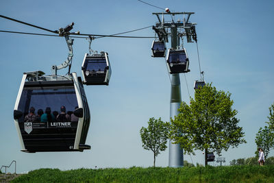 Low angle view of ski lift against sky