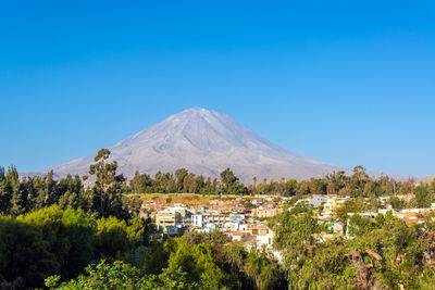 Residential district by misti volcano against clear sky