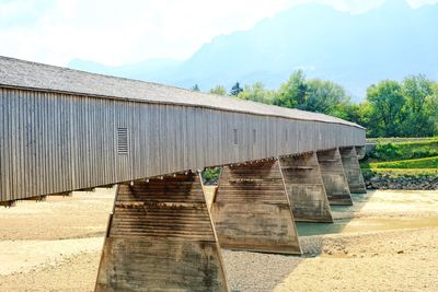 View of dam and bridge against sky