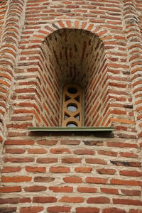 Low angle view of stone wall in building