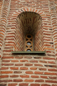 Low angle view of stone wall in building