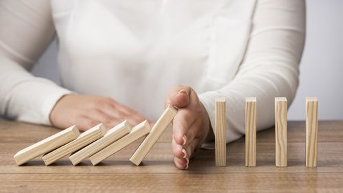 Midsection of businessman with clothespin on table