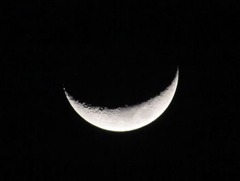 Low angle view of moon in sky at night