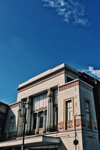 Low angle view of old building against blue sky