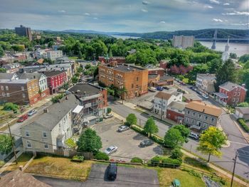 Buildings against cloudy sky