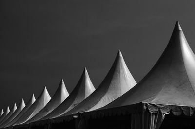 Low angle view of tents against sky