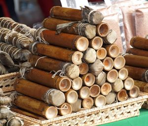 Close-up of bamboo tubes in tray on table