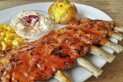 Close-up of pork ribs served on table