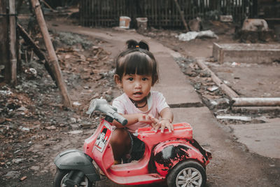 Portrait of cute boy toy car