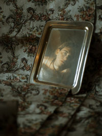 Close-up of electric lamp on mirror