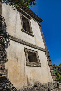 Low angle view of old building against sky