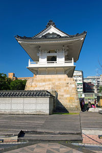 Low angle view of building against blue sky