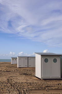 Built structure on beach against sky