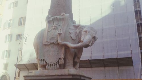 Low angle view of statue in city