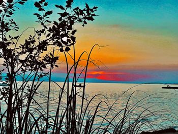 Scenic view of sea against sky during sunset