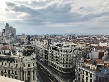 High angle view of buildings in city against sky