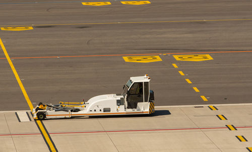 High angle view of airplane on airport runway