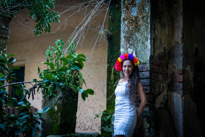 Woman standing by plants