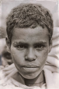 Close-up portrait of a serious young man