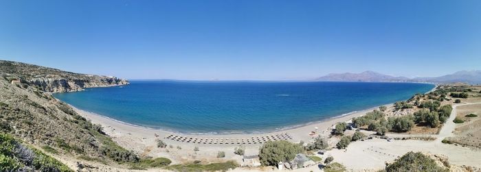 Scenic view of sea against clear blue sky