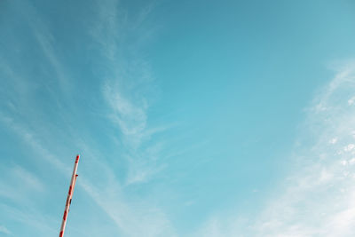 Low angle view of pole against blue sky