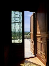 Buildings seen through closed window of house