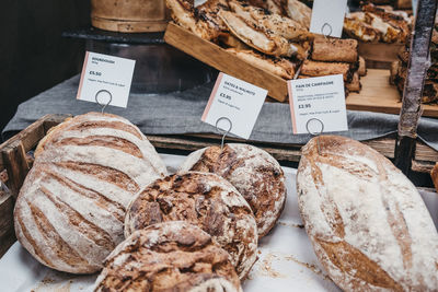 Variety of artisan bread on sale at a street market, selective focus.