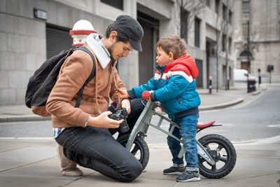 Father and son with umbrella