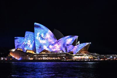 Reflection of illuminated buildings in water