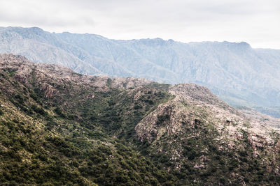 Scenic view of landscape and mountains against sky