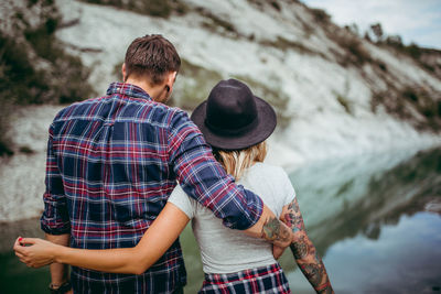 Young couple standing in water