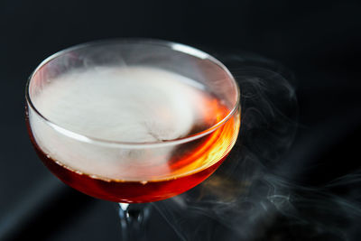 Close-up of drink against black background