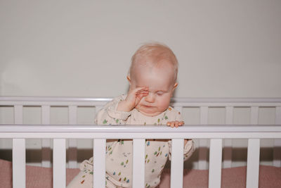 Portrait of cute baby boy looking away