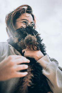 Portrait of woman with teddy bear