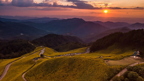 Scenic view of landscape against sky during sunset