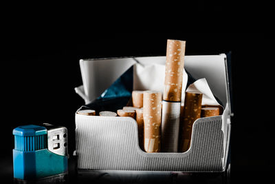 Close-up of objects on table against black background