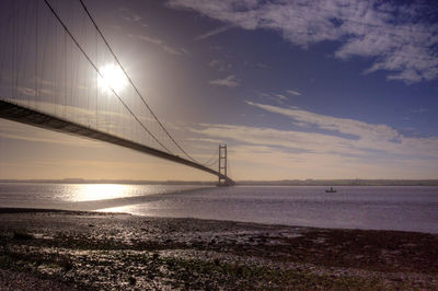 View of suspension bridge on beach
