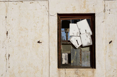 Broken window of old building