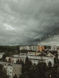 Buildings against sky during rainy season