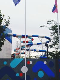 Close-up of flags hanging from swimming pool