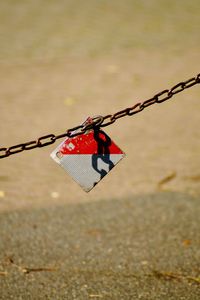 Close-up of chain hanging on rope