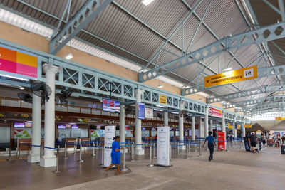 People waiting at railroad station platform