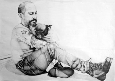 Portrait of man sitting on wall