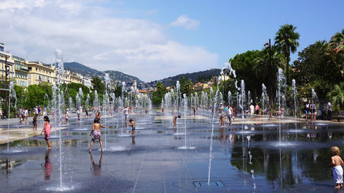 People having fun with water in nice, france