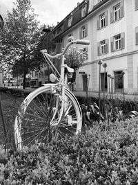 Bicycle on field by building